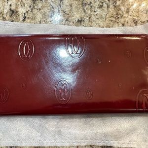 Authentic MUST DE patent Cartier Calfskin Leather wallet.